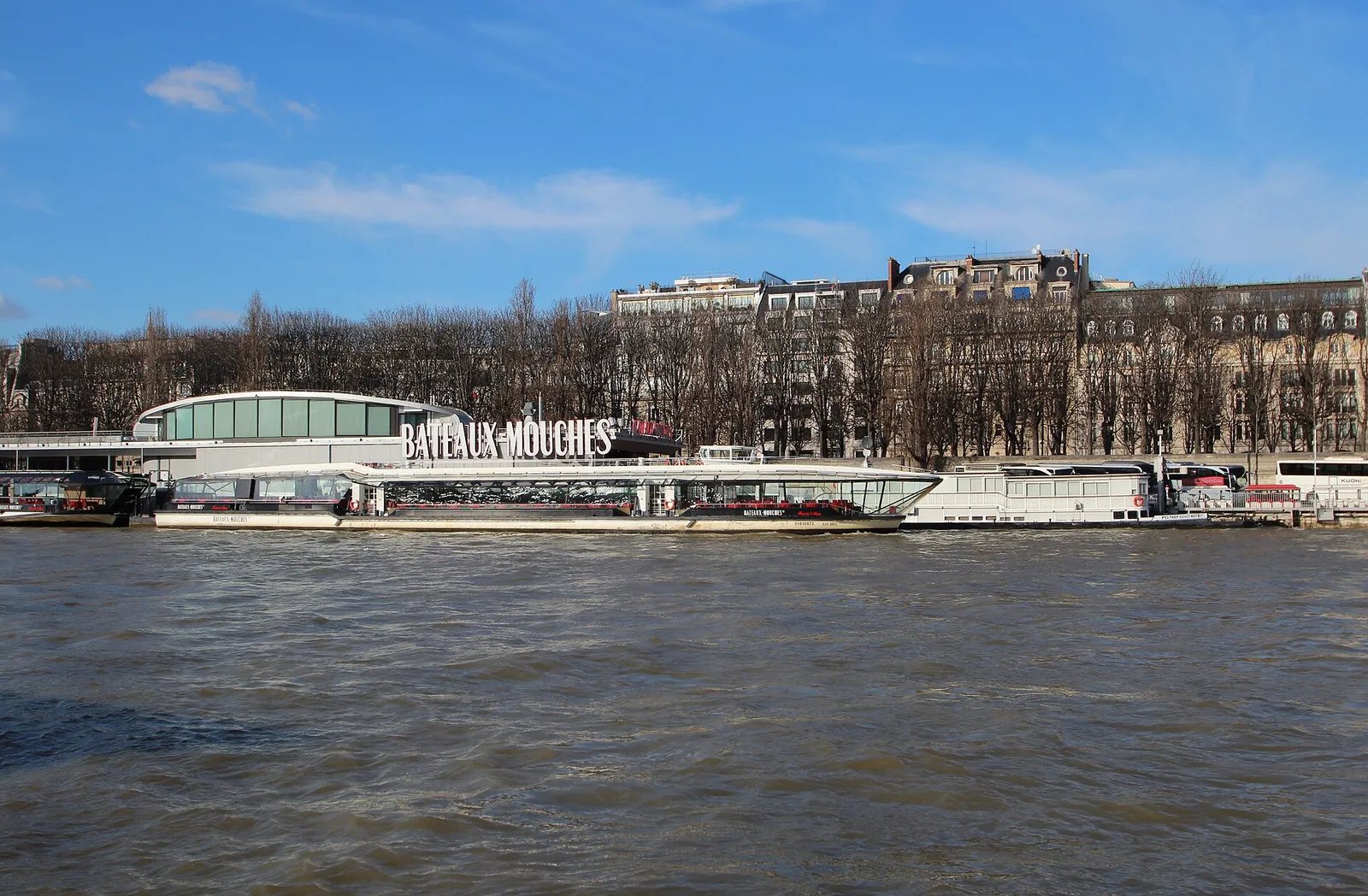 Bateaux-Mouches pier with a sightseeing boat moored at the quay, Port de la Conférence near the Pont de l'Alma, daytime